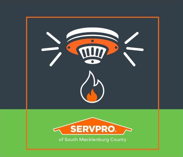 A logo of a fire alarm and the SERVPRO house Logo